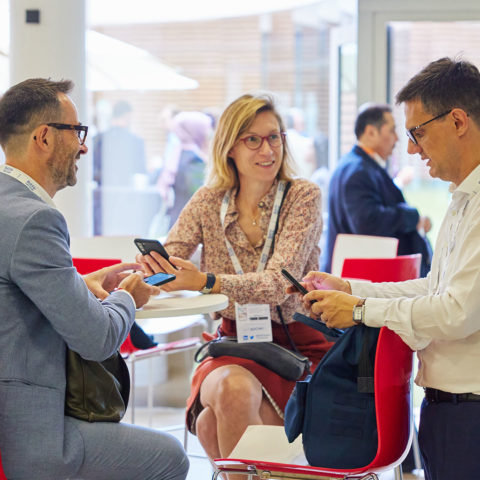 Visitors using the event mobile app at the UITP Summit
