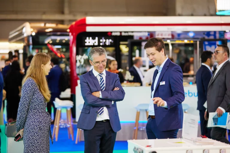 discussion at exhibition stand at the UITP Summit